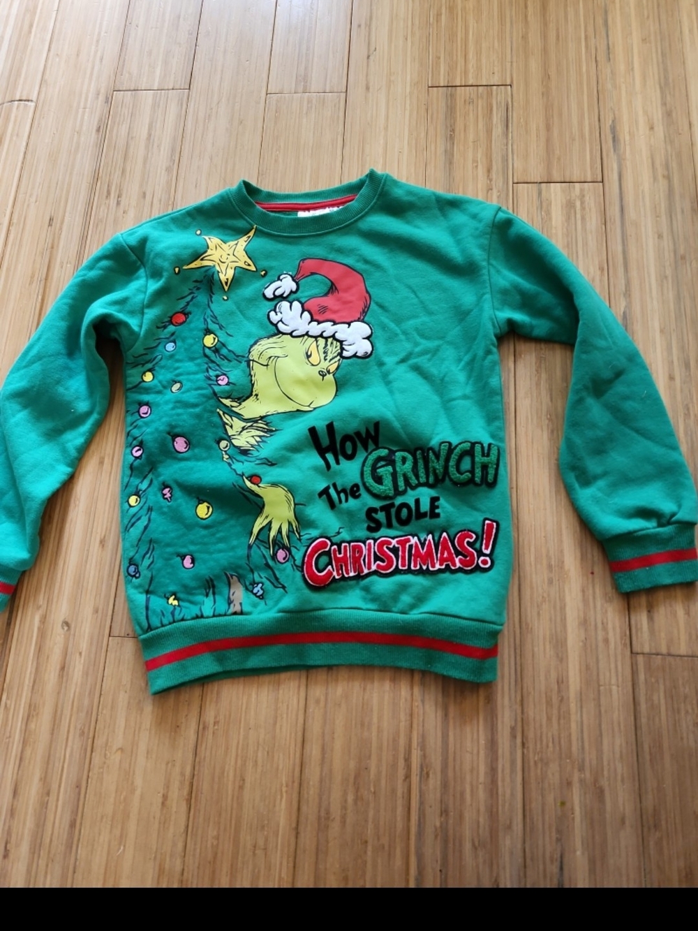 green Dr. Seuss The Grinch crewneck sweatshirt features a festive Christmas tree